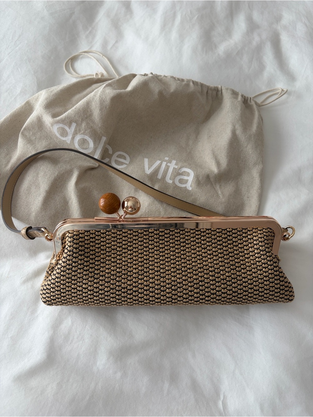 Dolce Vita Beige Woven Clutch with Rose Gold Frame and Wooden Bead